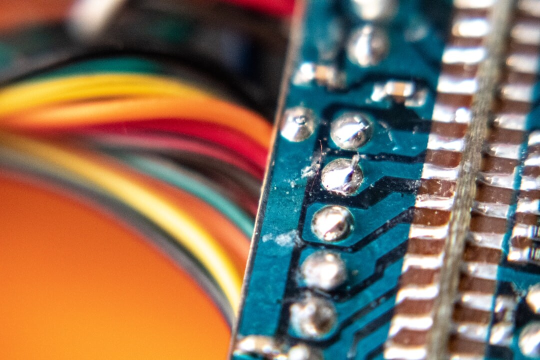 Close-up macro photo of glowing circuit board representing digital transformation