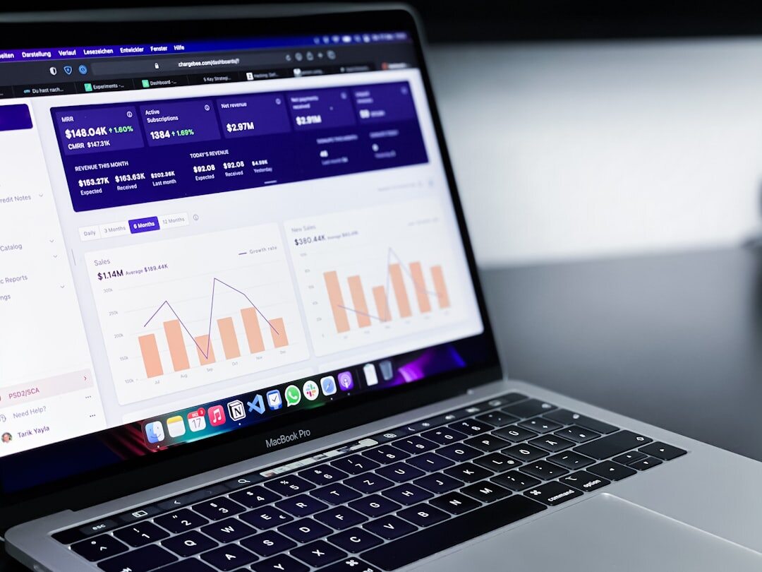 Modern laptop displaying colorful data analytics dashboard
